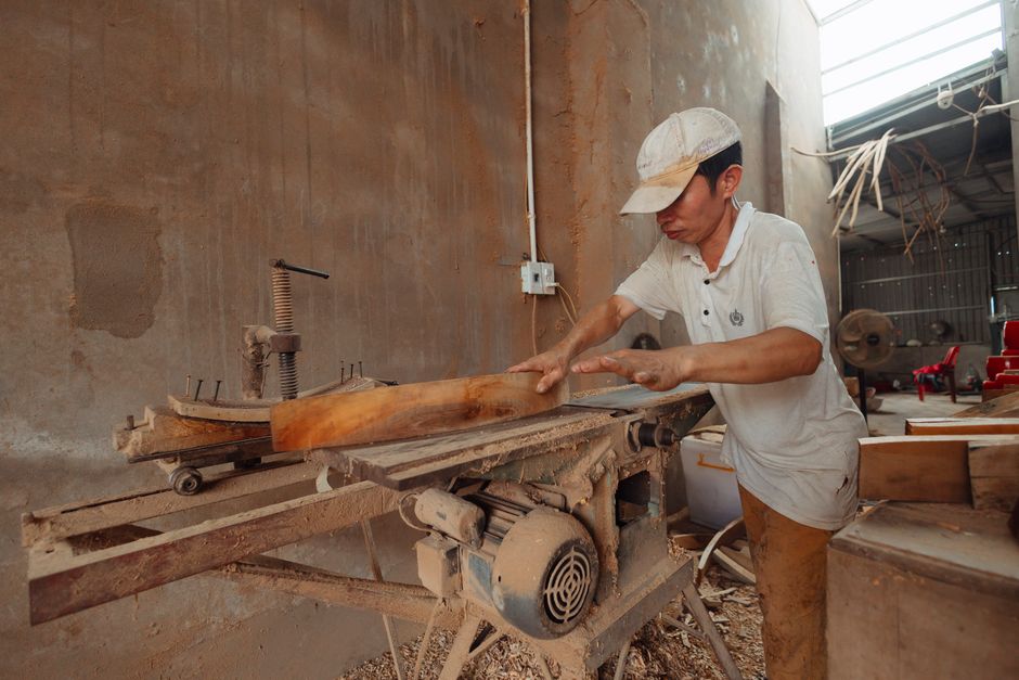 Carpenter crafting wood for handmade furniture